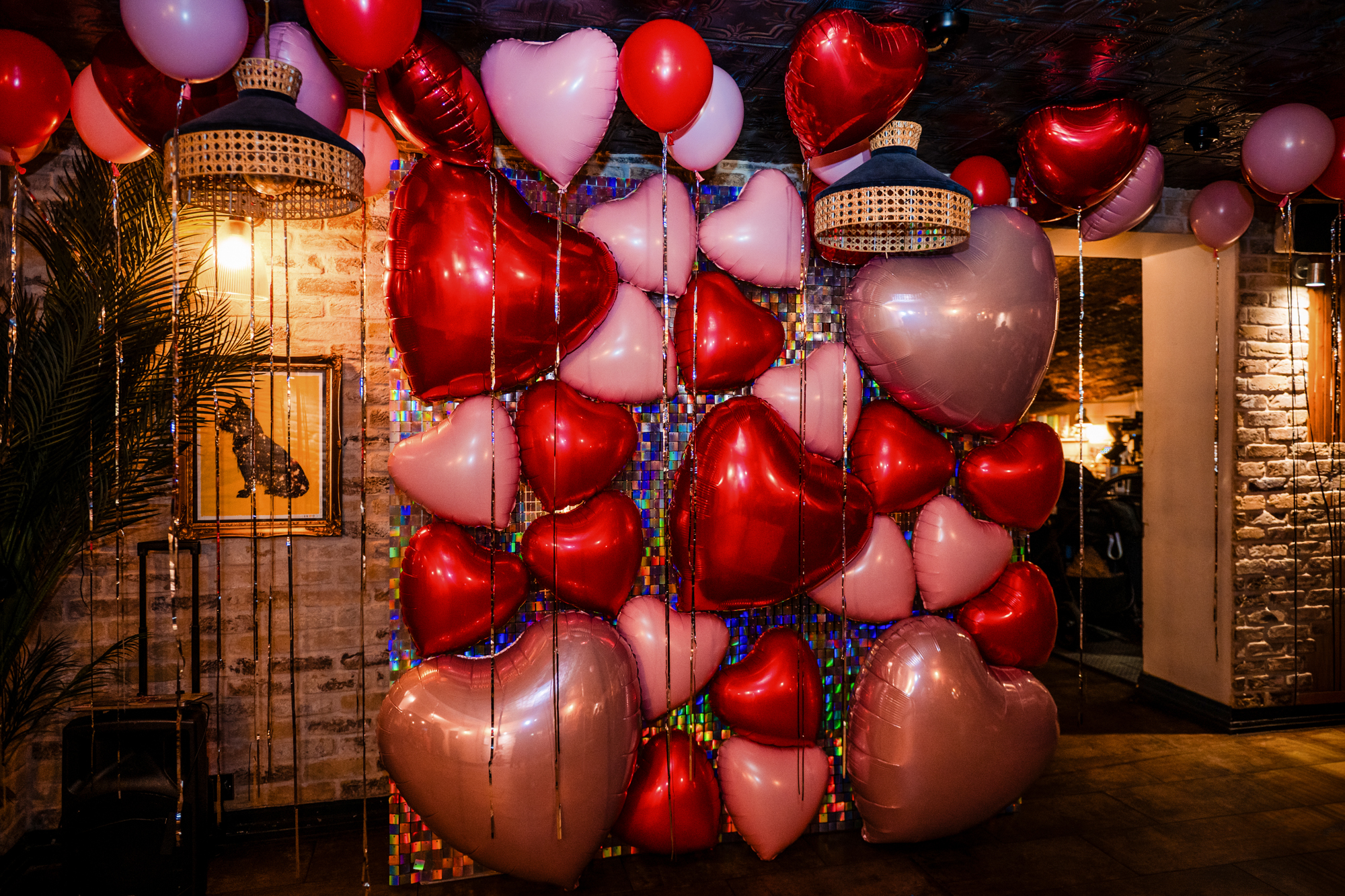 Red and pink heart balloons fill the Playroom at Racks Bar & Kitchen, Bristol.